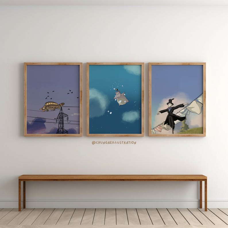 May include: Three framed art prints with whimsical illustrations. One features a turtle on power lines, another a hippo in the sky, and the third a figure in a black coat. The prints are displayed above a wooden bench.