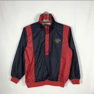 Vintage Lacoste embroidered patches logo half zipper half buttons pullover jacket sportswear active wear in red and blue in medium size