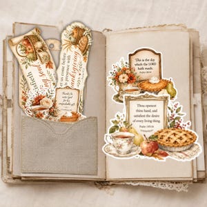 May include: A collection of paper die-cut stickers featuring Thanksgiving themes, including pumpkins, pies, teacups, and floral arrangements. The stickers display religious text such as 'This is the day which the LORD hath made' and 'Thou openest thine hand'.