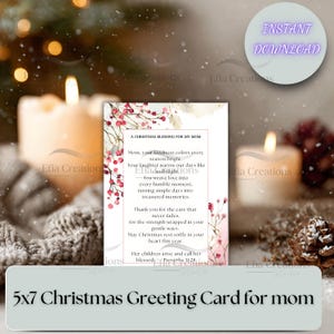 May include: A 5x7 Christmas greeting card for mom with a floral design and the text "A Christmas Blessing for My Mom." The card is surrounded by lit candles and festive decorations, creating a warm holiday atmosphere.