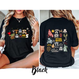 May include: Black t-shirt with Star Wars graphics and text. The front features the words "STAR WARS" with character illustrations. The back displays Star Wars quotes and images. The word "Black" is written at the bottom of the image.