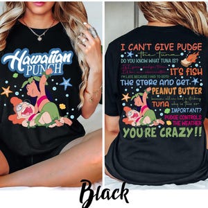 May include: Black t-shirt featuring a cartoon graphic of a character from the movie Lilo & Stitch. The front of the shirt says "Hawaiian Punch". The back of the shirt has text that says "I can't give Pudge the tuna..."
