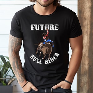 Camiseta, sudadera, sudadera con capucha y bolso de mano de vaquero de rodeo con toro mecánico - 247851