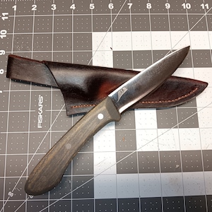 Hand forged knife with leather sheath. Made in USA