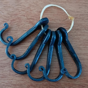 Set of 6 small hand forged hooks. Made in USA