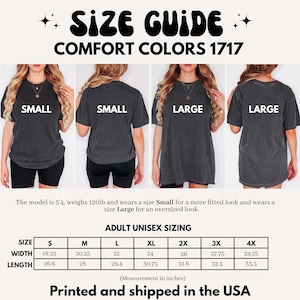 May include: A size guide for Comfort Colors 1717 t-shirts featuring four views of a charcoal grey shirt labelled Small and Large. Includes a sizing chart with width and length measurements in inches for sizes S through 4X, noting printed in the USA.