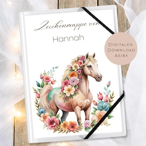 May include: White art portfolio with a watercolor illustration of a horse adorned with flowers. The text "Zeichenmappe von Hannah" and "DIGITALER DOWNLOAD A3/A4" are also visible. A black elastic band secures the portfolio.