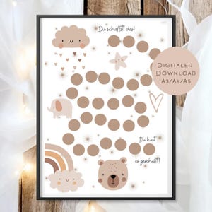Könnte beinhalten: Ein gerahmter Druck mit weißem Hintergrund, der eine Reihe brauner Kreise, eine Wolke, einen Regenbogen, einen Stern und eine Bärenillustration zeigt. Der Text enthält "Du schaffst das!" und "Du hast es geschafft!" mit "DIGITALER DOWNLOAD A3/A4/A5".