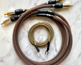 May include: Two brown braided audio cables with gold RCA connectors and a separate brown braided cable with bare wire ends. The cables are labeled "mule" in white text.