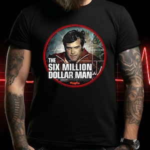 Six Million Dollar Man - Black / Red - Gildan SoftStyle® Ringspun T-Shirt