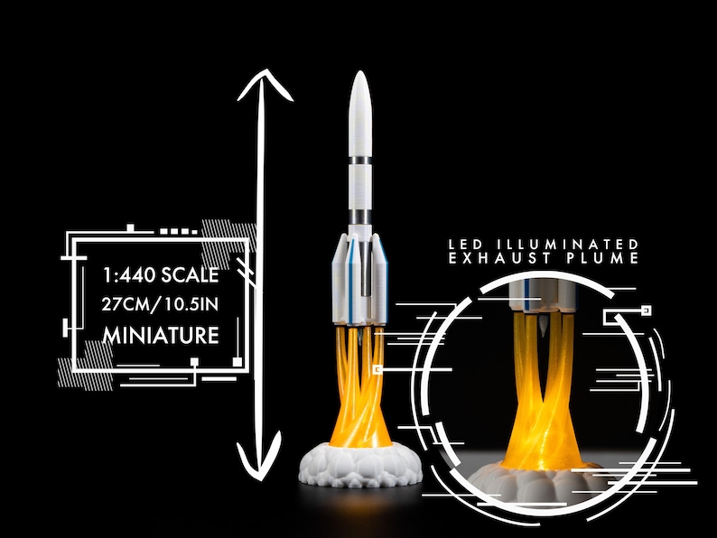 May include: Miniature rocket model, 10.5 inches tall, with LED illuminated exhaust plume. The rocket is white and silver with a white base. The image includes the text "1:440 SCALE 27CM/10.5IN MINIATURE" and "LED ILLUMINATED EXHAUST PLUME".