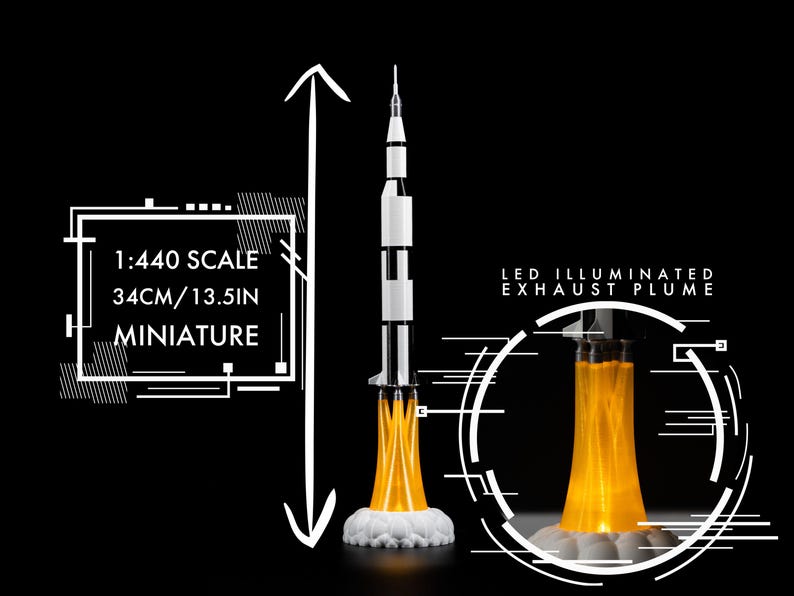 May include: A miniature model rocket, 13.5 inches tall, with a black and white body and an LED-illuminated exhaust plume. The model is 1:440 scale and sits on a white cloud-like base. The background is black.
