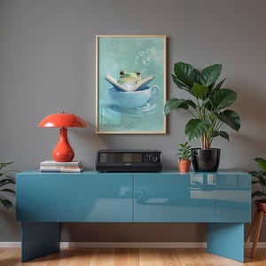 Cute frog reading book in teacup digital wall art