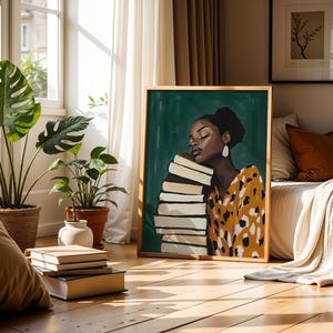 May include: A framed art print featuring a woman with her eyes closed, leaning against a stack of books. The woman wears a yellow and black patterned top and large white earrings. The artwork is set against a green background and framed in wood.
