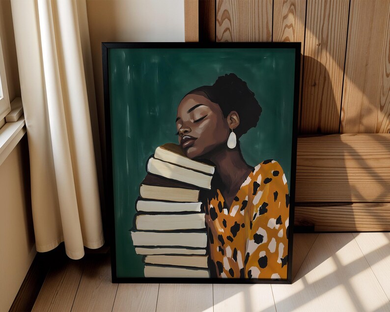 May include: A framed art print featuring a woman with dark skin resting her head on a stack of books. She wears a yellow and black patterned dress and white earrings. The background is a dark green color.