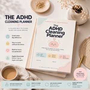 May include: The ADHD Cleaning Planner is a softcover book with a cream cover featuring a pink illustrated brain, the title in dark blue text, and sections for low, medium, and high energy tasks. It is 8.5 by 11 inches in size and printable.