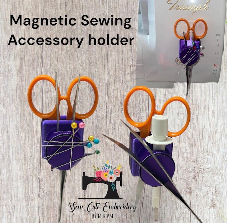 May include: A purple magnetic sewing accessory holder with orange-handled scissors, metal needles, and colorful pins. The holder features the text Magnetic Sewing Accessory holder and Sew Cute Embroidery BY MIRIAM. It is shown attached to a white machine.