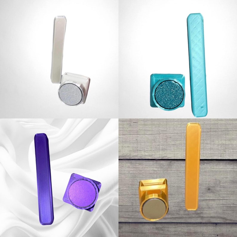 May include: Four sets of magnetic phone holders, each with a different colour and design. The holders are made of metal and have a round base with a rectangular bar attached to the top. The colours are silver, teal, purple, and gold.