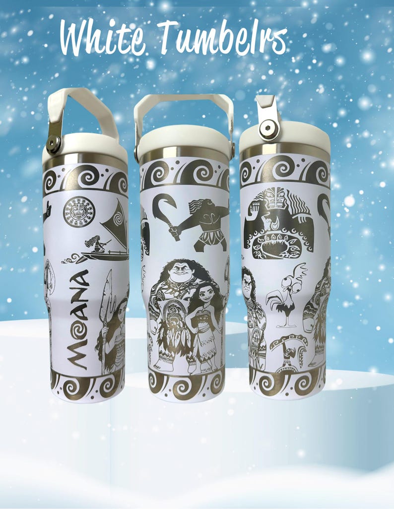 May include: Three white stainless steel tumblers with a Moana theme. The tumblers feature black and gold designs of Moana, Maui, and other characters from the film. The tumblers have a white lid with a black handle.