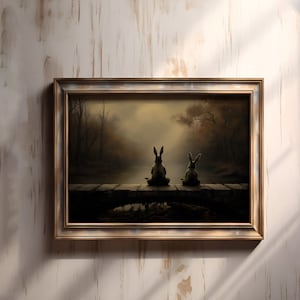 May include: A framed painting of two rabbits sitting on a wooden dock. The rabbits are facing away from the viewer and are looking out at a misty lake. The painting is set in a forest with trees and foliage in the background.