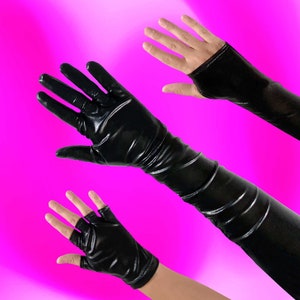 May include: Three pairs of black fingerless gloves. One pair is long and reaches above the elbow. The other two pairs are shorter and only cover the hand and wrist.