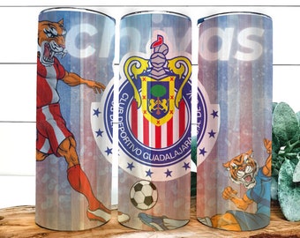 May include: Three stainless steel tumblers with a blue, white, and red design featuring a soccer team logo, a soccer ball, and a cartoon tiger. The logo says "Club Deportivo Guadalajara".