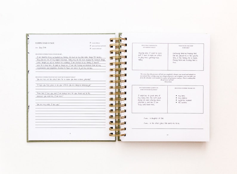 May include: A two-page spread from a green and white daily planner with a gold spiral binding. The left page has a section for "Gratitude" and "Daily Affirmations". The right page has sections for "How Will I Choose to Respond Today?" and "What is the Next Step Forward?"