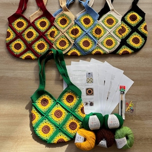 May include: A set of six crocheted sunflower tote bags in various colors, including red, beige, blue, cream, black, and green. The bags are made with a square pattern featuring sunflowers. The image also includes yarn balls, crochet hooks, and a pattern for making the bags.