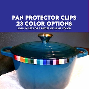 May include: A teal blue Dutch oven with a gold-colored knob and a row of colorful pan protector clips. The image includes text that reads "PAN PROTECTOR CLIPS 23 COLOR OPTIONS SOLD IN SETS OF 8 PIECES OF SAME COLOR."