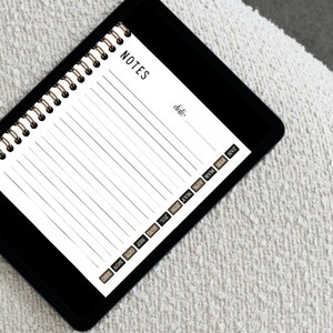 May include: A black and white spiral notebook with the word "NOTES" at the top. The notebook has a date field and a row of small labels along the bottom edge, including "DEC", "NOV", "OCT", "SEP", "AUG", "JUL", "JUN", "MAY", "APR", "MAR", "FEB", and "JAN".