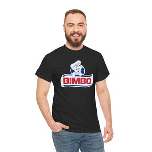 May include: Black t-shirt featuring the Bimbo logo, a white bear wearing a chef's hat, and the word "BIMBO" in red letters. The logo is set against a blue and white background. The shirt is made of a soft material.