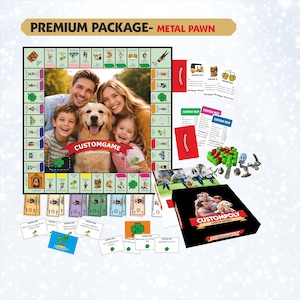 May include: A custom board game set featuring a game board with a central family photo, a black box labelled CUSTOMPOLY, stacks of play money, game cards with custom text, green plastic houses, metal pawns, and two white dice with black dots.