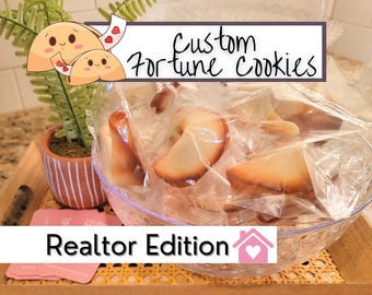 May include: A clear glass bowl filled with individually wrapped fortune cookies. The words "Custom Fortune Cookies" are displayed above the bowl. Below the bowl, the words "Realtor Edition" are displayed. A small potted plant and a wooden tray are also visible.