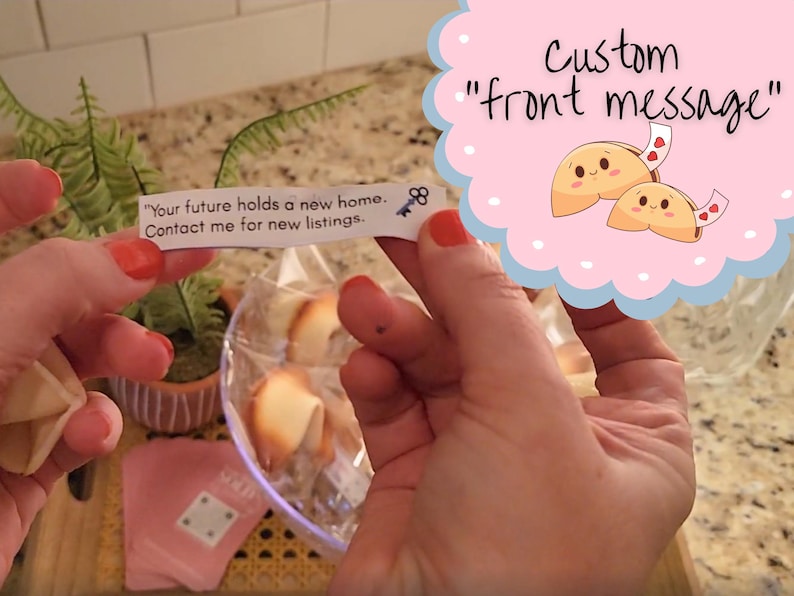 woman holding the custom fortune message showing the front of the message with the bowl of fortune cookies in the background