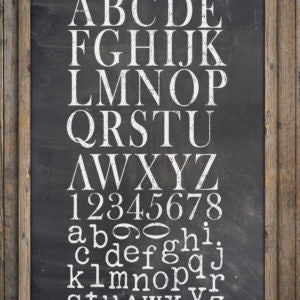 May include: A chalkboard with white lettering displaying the alphabet, uppercase and lowercase, and numbers. The chalkboard is framed with rustic wooden planks. The letters are in a serif font.