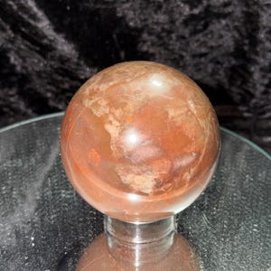 May include: A set of three ceramic mugs with a speckled, matte finish. The mugs are in shades of cream, light gray, and dark gray. Each mug has a simple, minimalist design, perfect for coffee or tea.