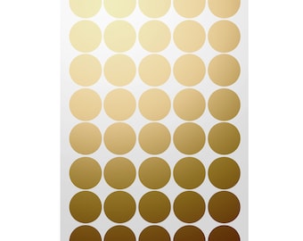 May include: A sheet of gold and brown round stickers. The stickers are arranged in a grid pattern, with the gold stickers at the top and the brown stickers at the bottom.