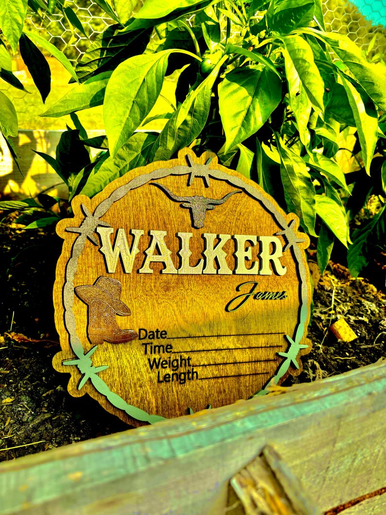 May include: A wooden sign with a cowboy hat and a longhorn design. The sign says "WALKER" and has a space for a name, date, time, weight, and length.