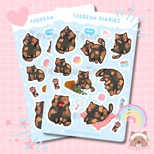 May include: Two sticker sheets with cartoon cat illustrations. The cats are depicted in black and orange, with additional stickers showing cat paws, a rainbow, and a can of cat food. The text "TOEBEAN DIARIES" is printed at the top of the sheets.