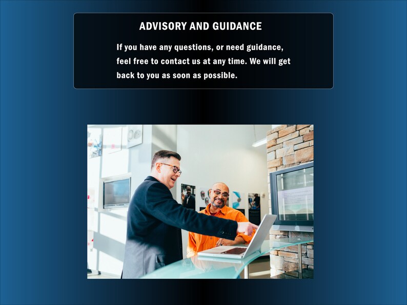 May include: Two people are looking at a laptop computer. The person on the left is wearing a black suit and glasses. The person on the right is wearing an orange shirt and has a beard. The background is a brick wall.