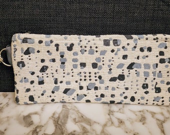 Handmade versatile fabric zipper pouch, makeup bag, pencil case, clutch purse, coin purse, made from repurposed fabric.