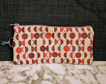 Handmade versatile fabric zipper pouch, makeup bag, pencil case, clutch purse, coin purse, made from repurposed fabric.