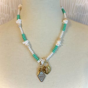 beaded necklace with hotel key charm