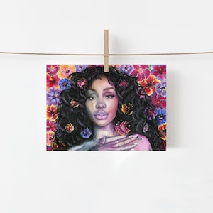 May include: A rectangular art print featuring a portrait of a person with voluminous dark curly hair adorned with vibrant, multi-colored flowers. The background is filled with a dense pattern of red, orange, purple, and blue floral blossoms.