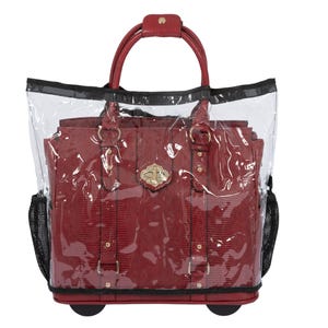 May include: A clear plastic bag with a black zipper and a red handbag with gold accents inside. The bag has wheels and a handle.