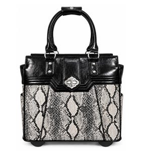 May include: A structured handbag featuring a black top section and a grey and black snakeskin-patterned lower body. It includes two black handles, a silver-toned metal turn-lock closure, and side pockets. The base is equipped with small wheels.