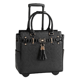 May include: A black rolling tote bag with a snakeskin texture. The bag has a telescoping handle, top handles, and gold-colored hardware. A black tassel hangs from the front. The bag has two side pockets and is designed for travel or business.