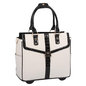 May include: A white rolling tote bag with black accents. The bag features a structured design with a black handle, trim, and a central strap with a gold-colored buckle. It has two small wheels on the bottom and a side pocket.