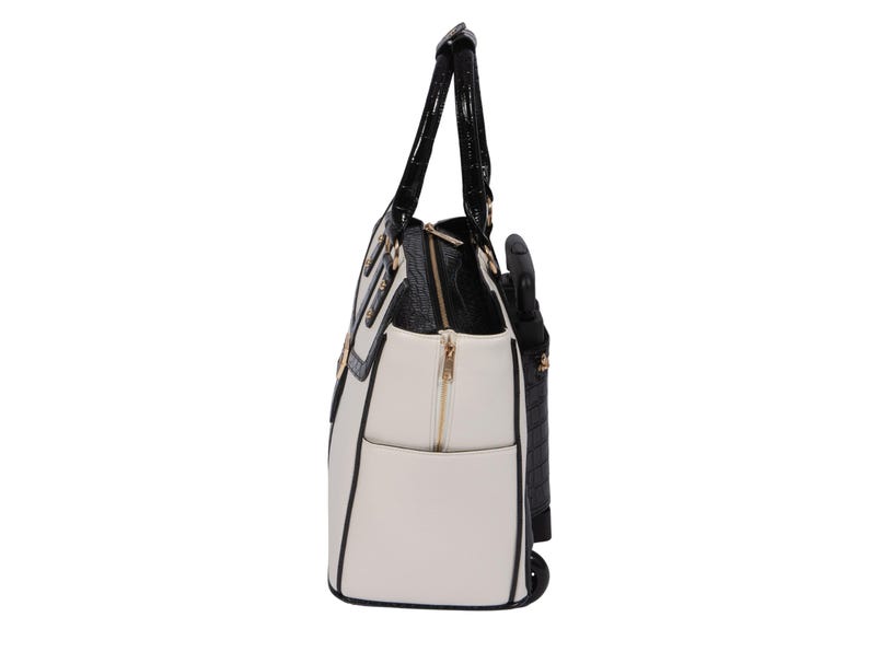 Side profile of a women’s laptop bag on wheels in white and black with croc-trim and deep side pockets and expandable zipper option. This stylish carry-on or weekender with wheels for women is ideal for daily commutes, weekend trips, or conventions. Use it as a nursing school bag, flight attendant roller bag, or fashionable laptop rolling briefcase. A great gift for her, this travel tote with wheels helps eliminate shoulder strain by putting your essentials on wheels and adds effortless style.