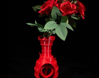 Jarrón de corazón y flores